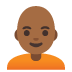 person, medium-dark skin tone, bald